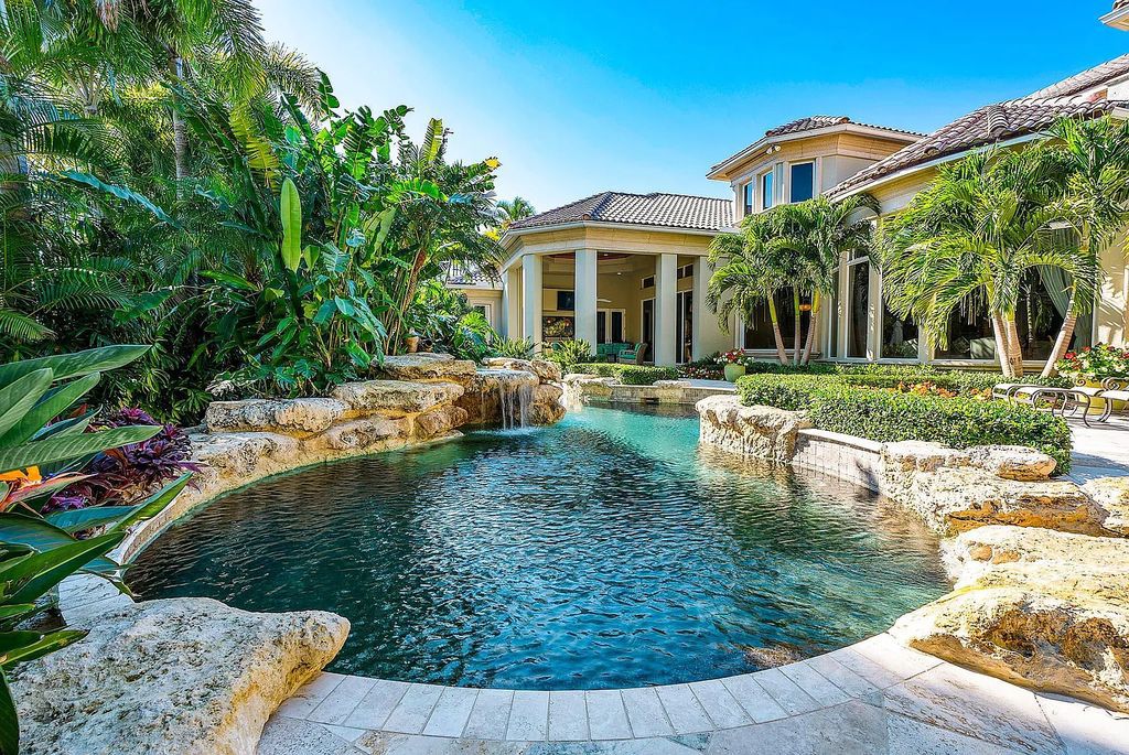 Discover unparalleled beauty in this prestigious waterfront estate located at 174 W Coconut Palm Road, Boca Raton's Royal Palm Yacht & Country Club, Florida. With captivating waterway views, this architectural marvel offers a tropical oasis on over half an acre of lush greenery.