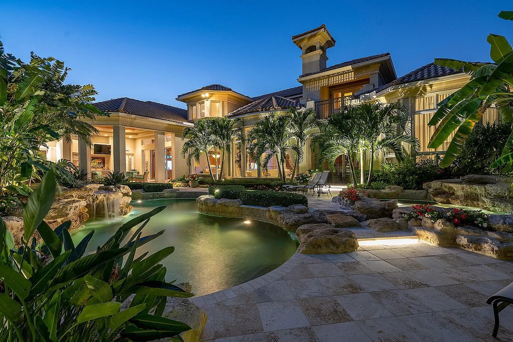 Discover unparalleled beauty in this prestigious waterfront estate located at 174 W Coconut Palm Road, Boca Raton's Royal Palm Yacht & Country Club, Florida. With captivating waterway views, this architectural marvel offers a tropical oasis on over half an acre of lush greenery.