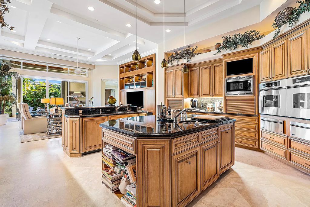 Discover unparalleled beauty in this prestigious waterfront estate located at 174 W Coconut Palm Road, Boca Raton's Royal Palm Yacht & Country Club, Florida. With captivating waterway views, this architectural marvel offers a tropical oasis on over half an acre of lush greenery.