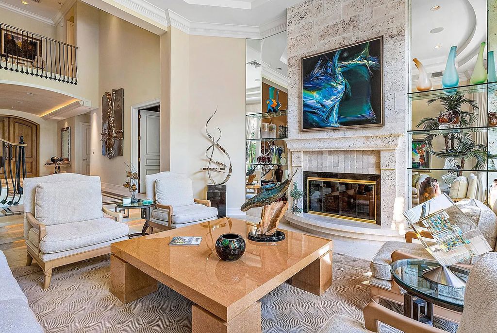 Discover unparalleled beauty in this prestigious waterfront estate located at 174 W Coconut Palm Road, Boca Raton's Royal Palm Yacht & Country Club, Florida. With captivating waterway views, this architectural marvel offers a tropical oasis on over half an acre of lush greenery.