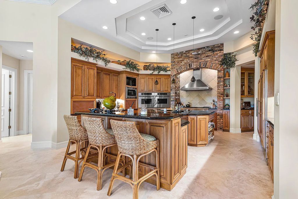 Discover unparalleled beauty in this prestigious waterfront estate located at 174 W Coconut Palm Road, Boca Raton's Royal Palm Yacht & Country Club, Florida. With captivating waterway views, this architectural marvel offers a tropical oasis on over half an acre of lush greenery.