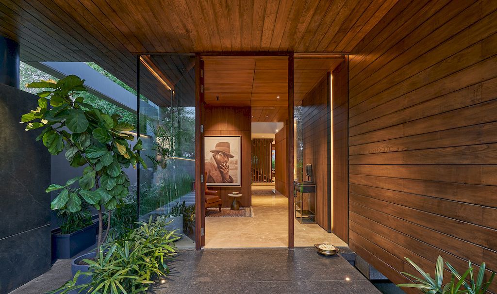 Corner House Connected to Well-landscaped Outdoors by DADA Partners
