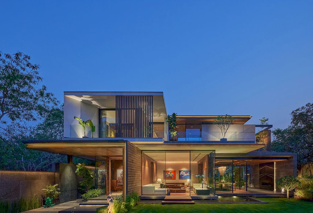 Corner House Connected to Well-landscaped Outdoors by DADA Partners