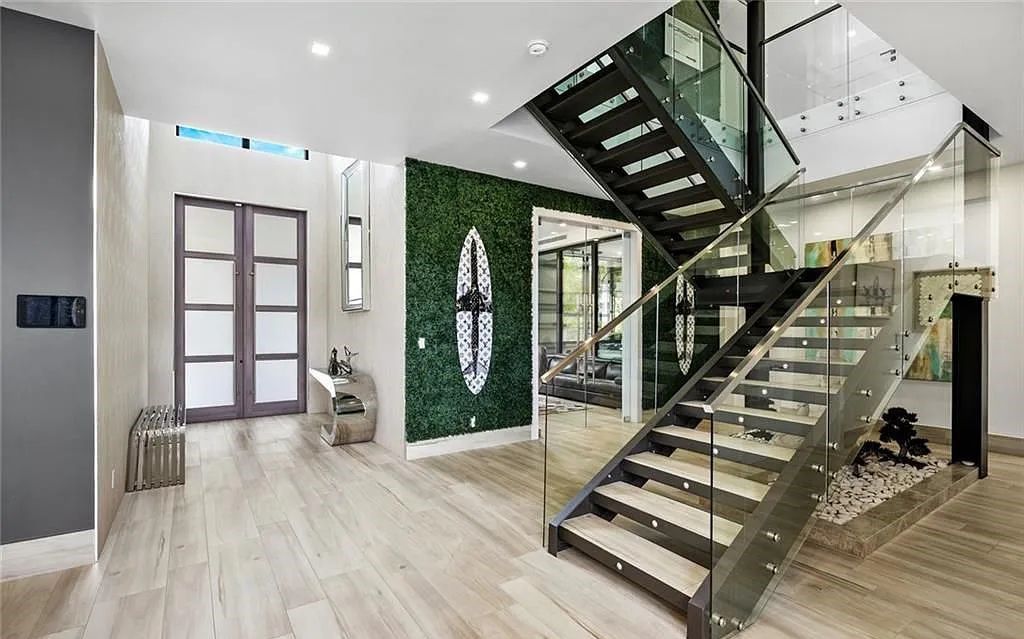 Experience luxury waterfront living at its finest at 2437 Delmar Place, Fort Lauderdale, Florida! This stunning modern estate features 6 bedrooms, 10 bathrooms, and over 7,000 sq ft of living space on an oversized lot with a 12x103 ft concrete dock and privacy gate.