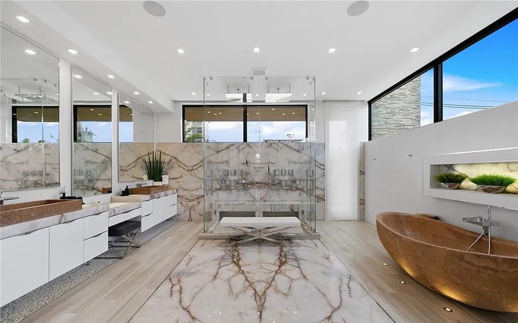 Experience luxury waterfront living at its finest at 2437 Delmar Place, Fort Lauderdale, Florida! This stunning modern estate features 6 bedrooms, 10 bathrooms, and over 7,000 sq ft of living space on an oversized lot with a 12x103 ft concrete dock and privacy gate.