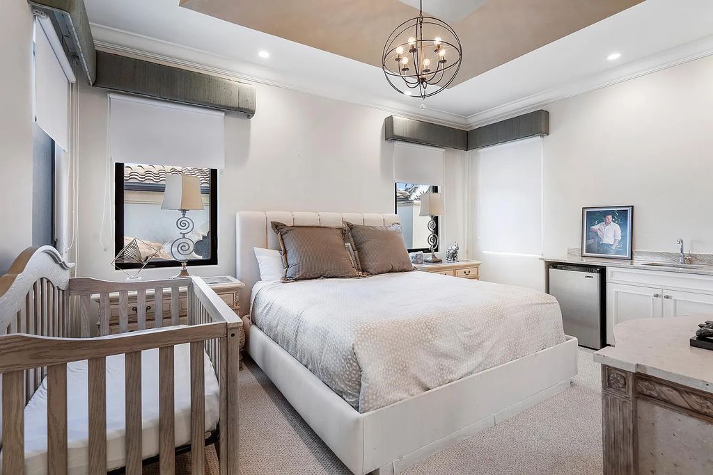Experience the epitome of luxury living at 420 E Coconut Palm Road, Boca Raton, Florida. This meticulously renovated waterfront estate showcases 7 beds, 9 baths, and 7,216 sq ft of opulent living space.