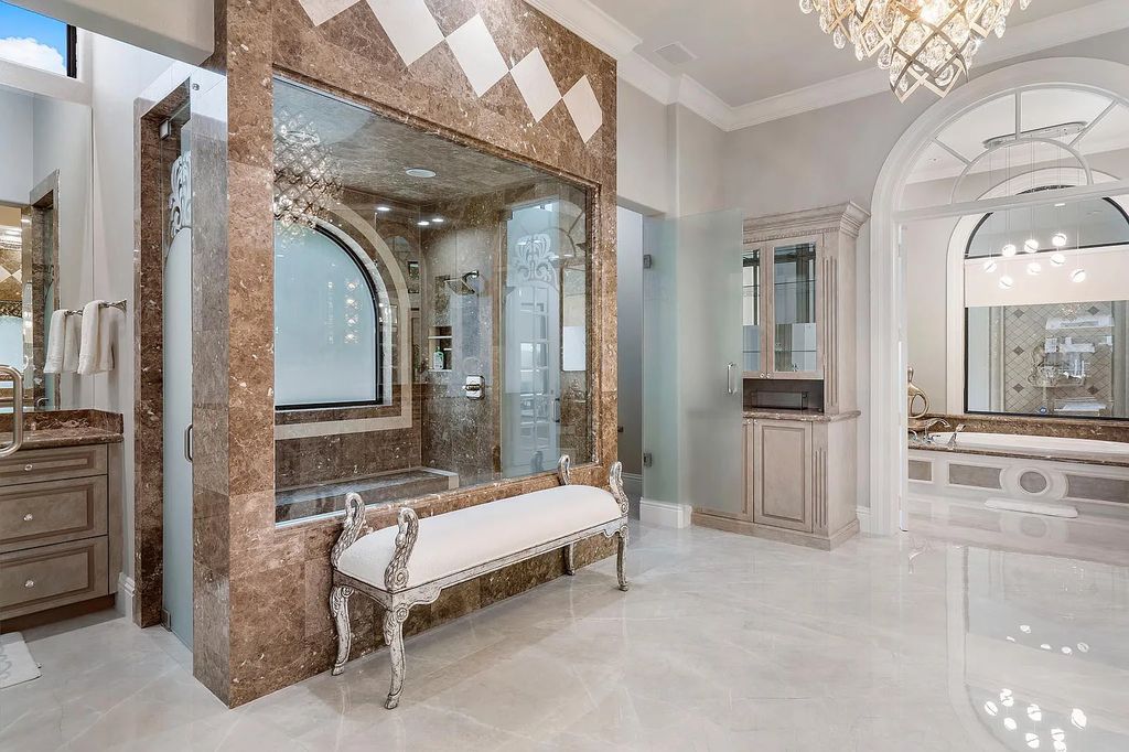 Experience the epitome of luxury living at 420 E Coconut Palm Road, Boca Raton, Florida. This meticulously renovated waterfront estate showcases 7 beds, 9 baths, and 7,216 sq ft of opulent living space.