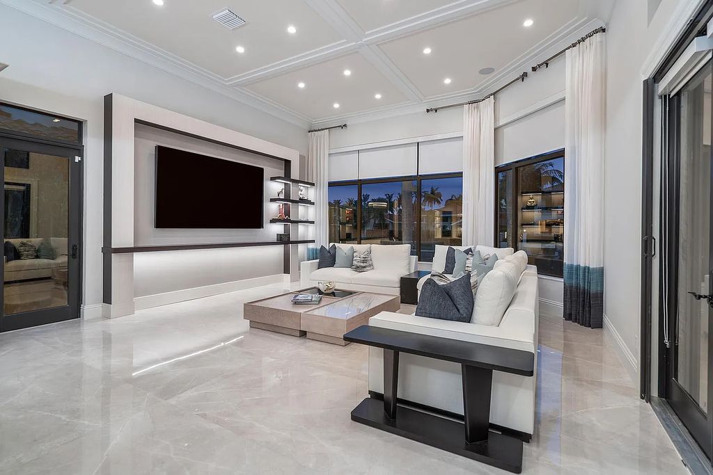 Experience the epitome of luxury living at 420 E Coconut Palm Road, Boca Raton, Florida. This meticulously renovated waterfront estate showcases 7 beds, 9 baths, and 7,216 sq ft of opulent living space.