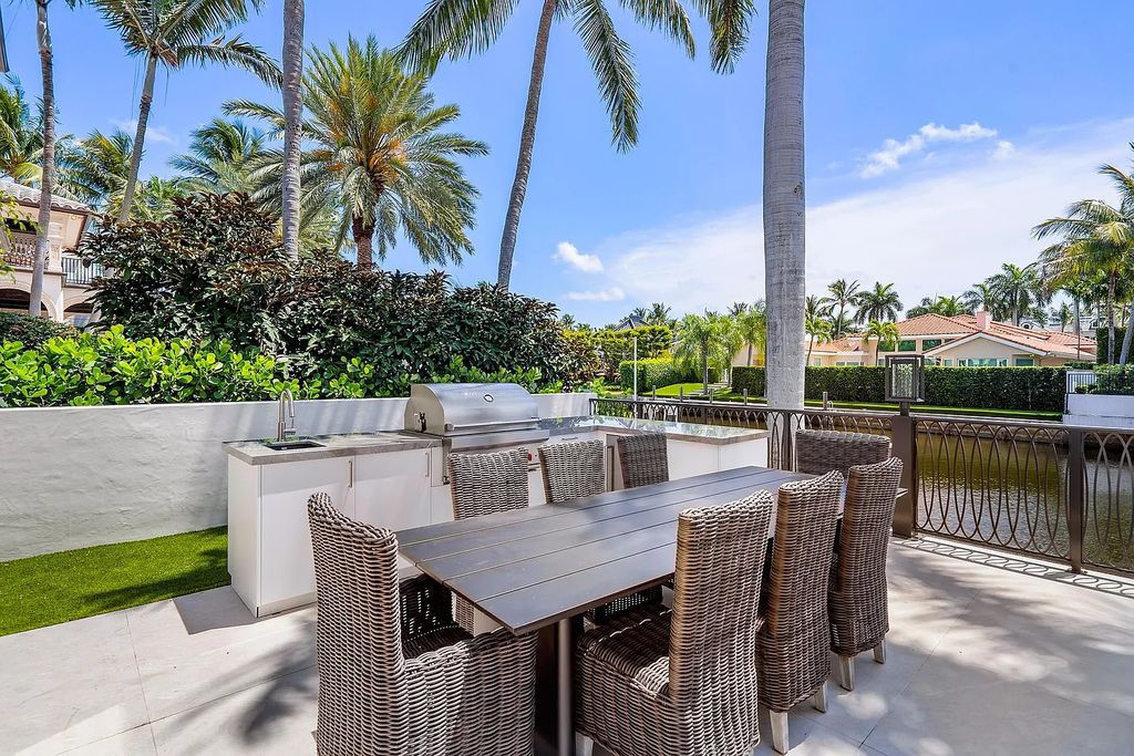 Experience the epitome of luxury living at 420 E Coconut Palm Road, Boca Raton, Florida. This meticulously renovated waterfront estate showcases 7 beds, 9 baths, and 7,216 sq ft of opulent living space.