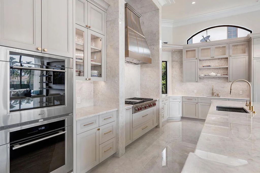 Experience the epitome of luxury living at 420 E Coconut Palm Road, Boca Raton, Florida. This meticulously renovated waterfront estate showcases 7 beds, 9 baths, and 7,216 sq ft of opulent living space.