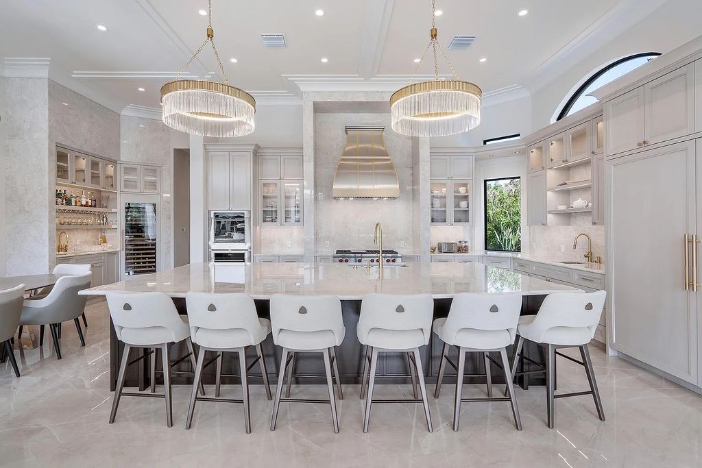 Experience the epitome of luxury living at 420 E Coconut Palm Road, Boca Raton, Florida. This meticulously renovated waterfront estate showcases 7 beds, 9 baths, and 7,216 sq ft of opulent living space.