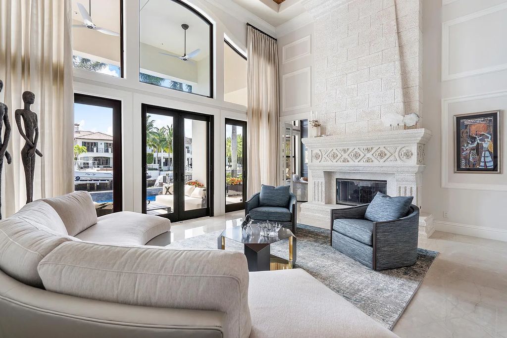 Experience the epitome of luxury living at 420 E Coconut Palm Road, Boca Raton, Florida. This meticulously renovated waterfront estate showcases 7 beds, 9 baths, and 7,216 sq ft of opulent living space.