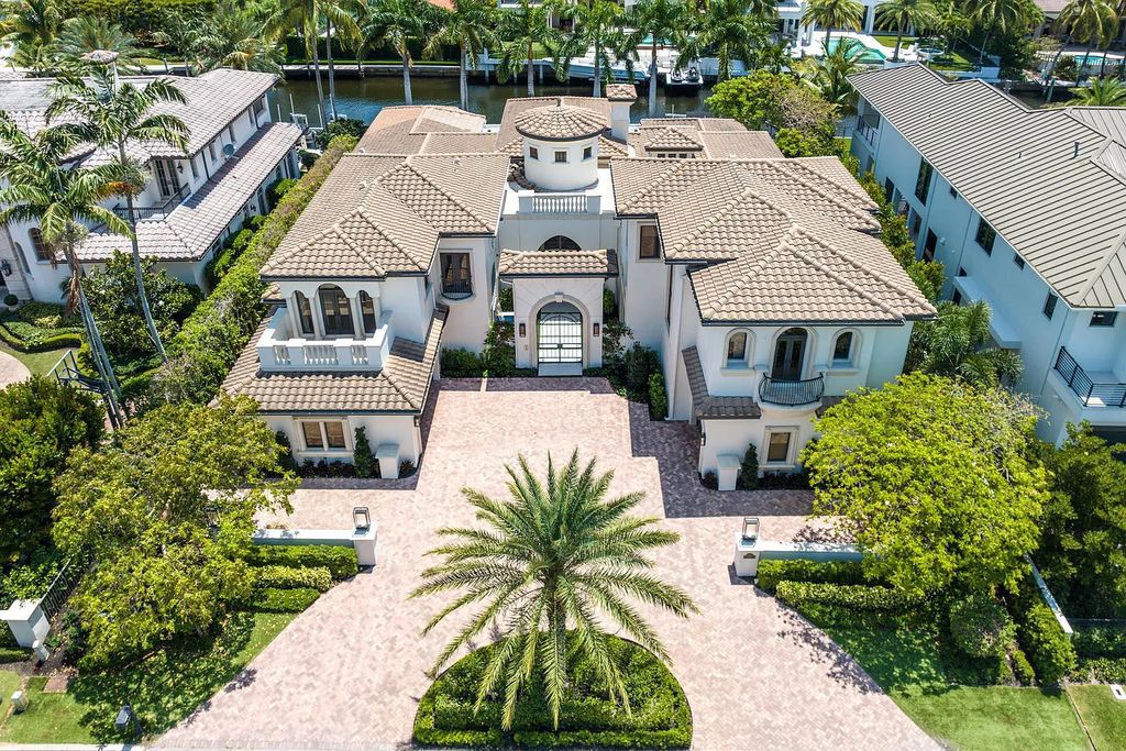 Experience the epitome of luxury living at 420 E Coconut Palm Road, Boca Raton, Florida. This meticulously renovated waterfront estate showcases 7 beds, 9 baths, and 7,216 sq ft of opulent living space.