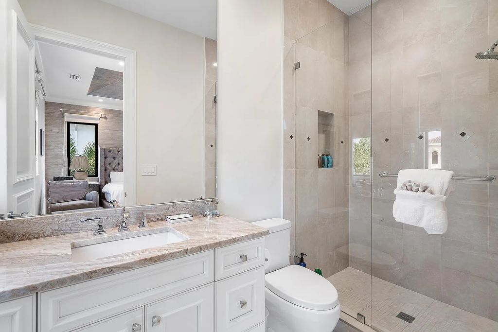 Experience the epitome of luxury living at 420 E Coconut Palm Road, Boca Raton, Florida. This meticulously renovated waterfront estate showcases 7 beds, 9 baths, and 7,216 sq ft of opulent living space.