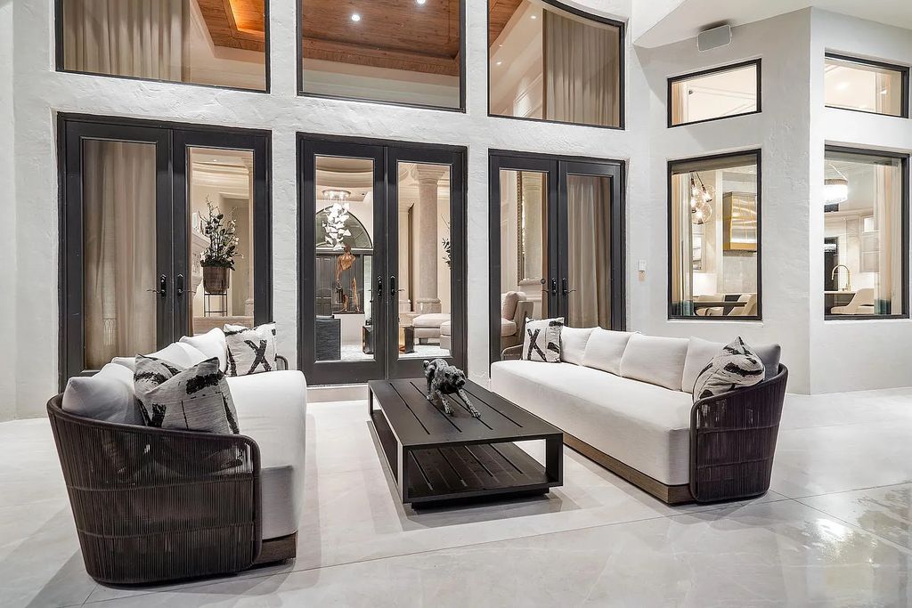 Experience the epitome of luxury living at 420 E Coconut Palm Road, Boca Raton, Florida. This meticulously renovated waterfront estate showcases 7 beds, 9 baths, and 7,216 sq ft of opulent living space.