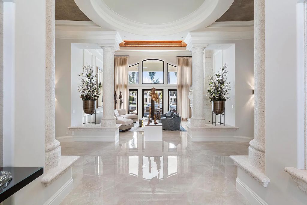 Experience the epitome of luxury living at 420 E Coconut Palm Road, Boca Raton, Florida. This meticulously renovated waterfront estate showcases 7 beds, 9 baths, and 7,216 sq ft of opulent living space.