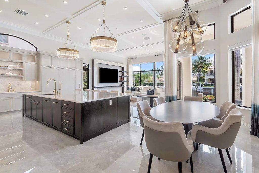 Experience the epitome of luxury living at 420 E Coconut Palm Road, Boca Raton, Florida. This meticulously renovated waterfront estate showcases 7 beds, 9 baths, and 7,216 sq ft of opulent living space.