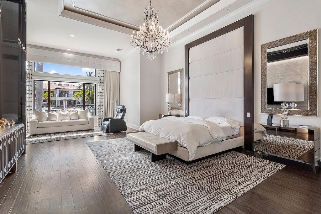 Experience the epitome of luxury living at 420 E Coconut Palm Road, Boca Raton, Florida. This meticulously renovated waterfront estate showcases 7 beds, 9 baths, and 7,216 sq ft of opulent living space.