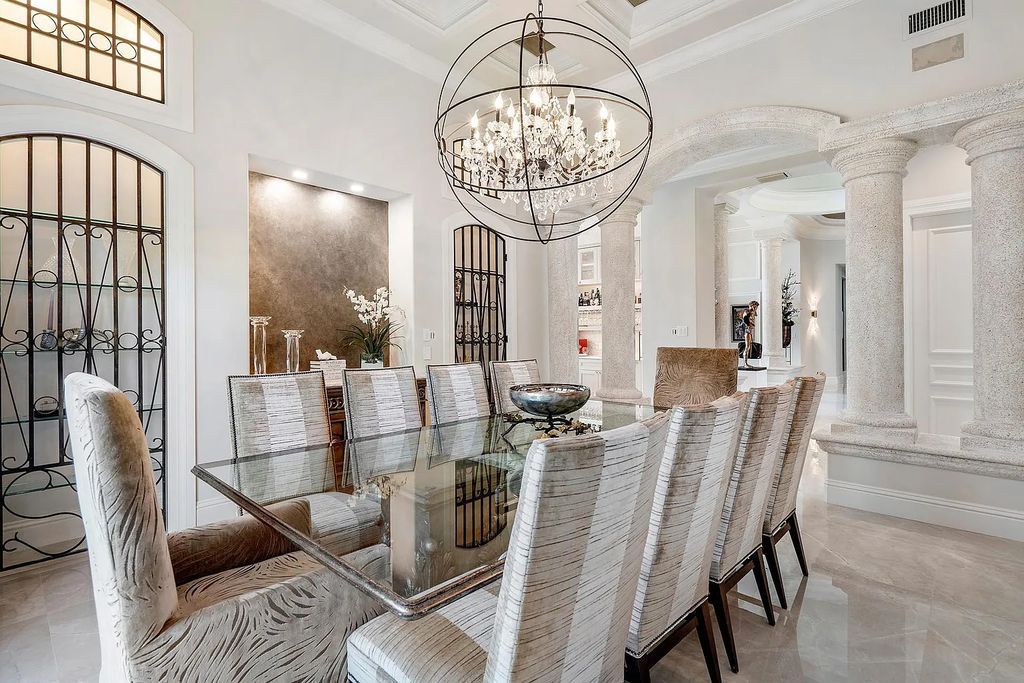 Experience the epitome of luxury living at 420 E Coconut Palm Road, Boca Raton, Florida. This meticulously renovated waterfront estate showcases 7 beds, 9 baths, and 7,216 sq ft of opulent living space.