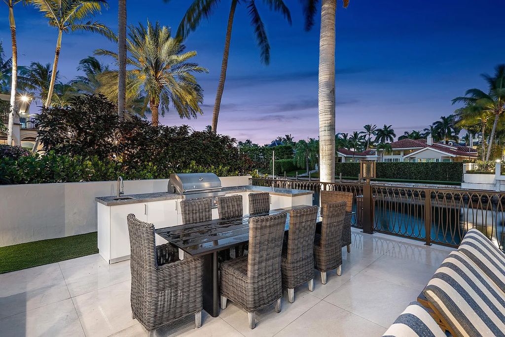 Experience the epitome of luxury living at 420 E Coconut Palm Road, Boca Raton, Florida. This meticulously renovated waterfront estate showcases 7 beds, 9 baths, and 7,216 sq ft of opulent living space.