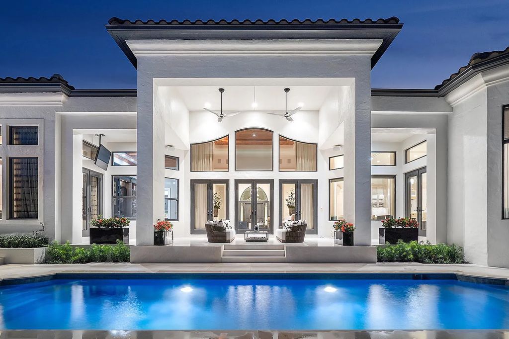 Experience the epitome of luxury living at 420 E Coconut Palm Road, Boca Raton, Florida. This meticulously renovated waterfront estate showcases 7 beds, 9 baths, and 7,216 sq ft of opulent living space.