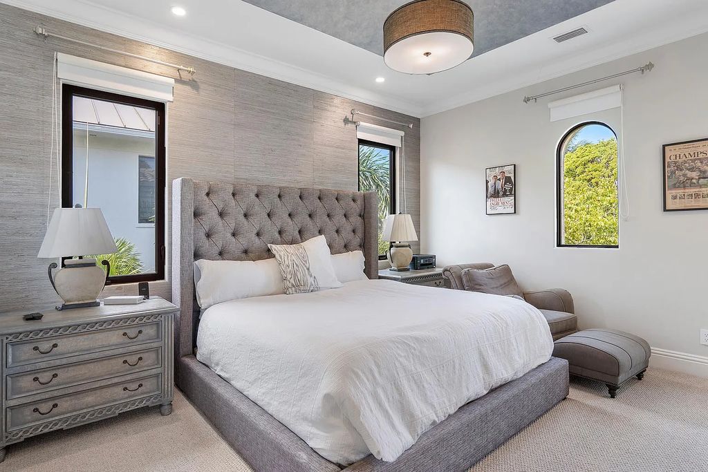 Experience the epitome of luxury living at 420 E Coconut Palm Road, Boca Raton, Florida. This meticulously renovated waterfront estate showcases 7 beds, 9 baths, and 7,216 sq ft of opulent living space.