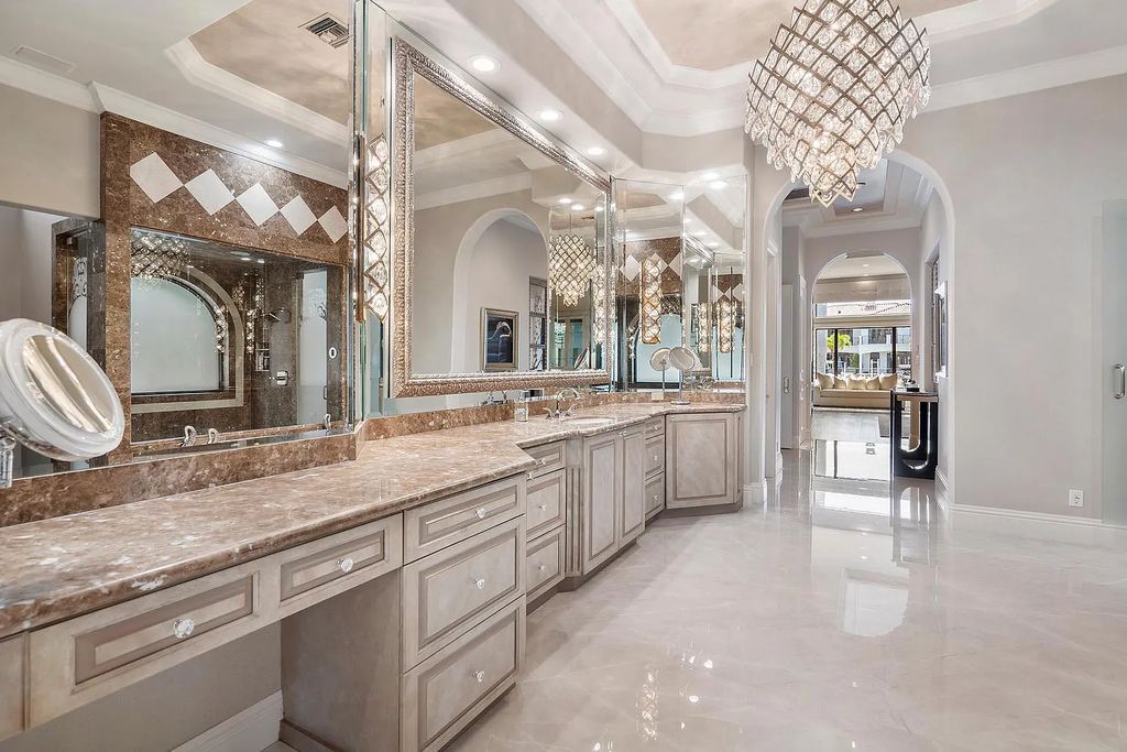 Experience the epitome of luxury living at 420 E Coconut Palm Road, Boca Raton, Florida. This meticulously renovated waterfront estate showcases 7 beds, 9 baths, and 7,216 sq ft of opulent living space.