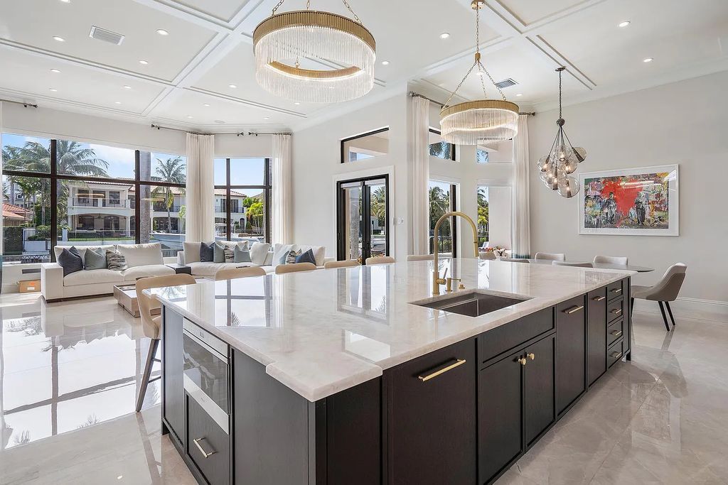Experience the epitome of luxury living at 420 E Coconut Palm Road, Boca Raton, Florida. This meticulously renovated waterfront estate showcases 7 beds, 9 baths, and 7,216 sq ft of opulent living space.