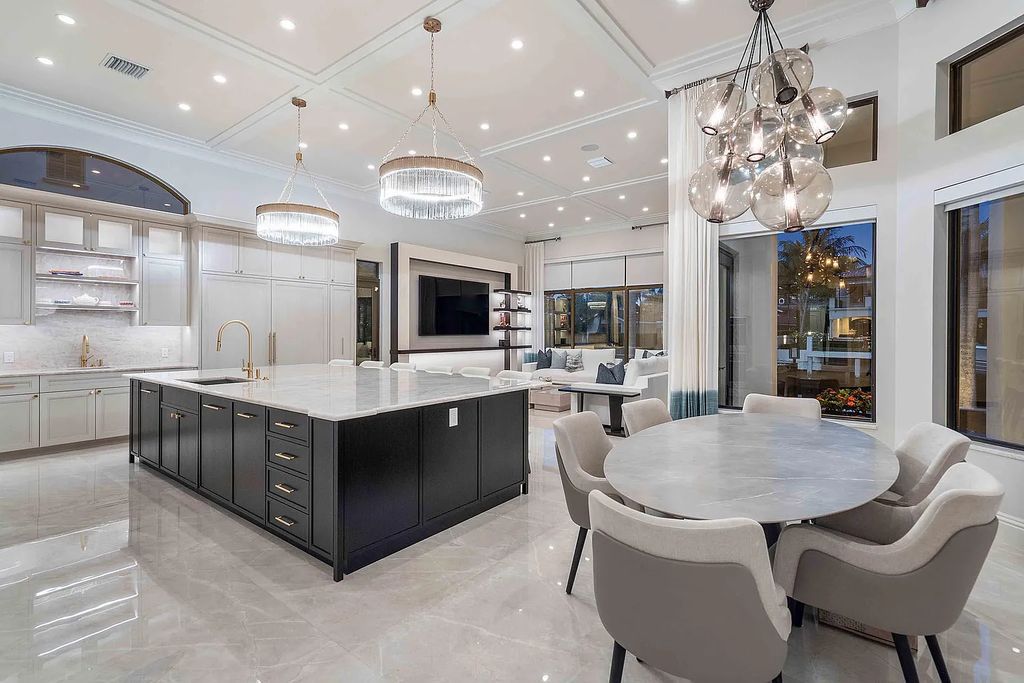 Experience the epitome of luxury living at 420 E Coconut Palm Road, Boca Raton, Florida. This meticulously renovated waterfront estate showcases 7 beds, 9 baths, and 7,216 sq ft of opulent living space.