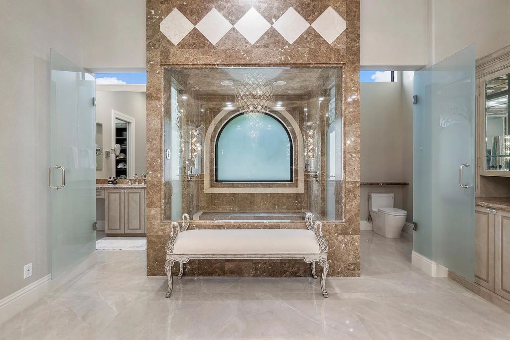 Experience the epitome of luxury living at 420 E Coconut Palm Road, Boca Raton, Florida. This meticulously renovated waterfront estate showcases 7 beds, 9 baths, and 7,216 sq ft of opulent living space.