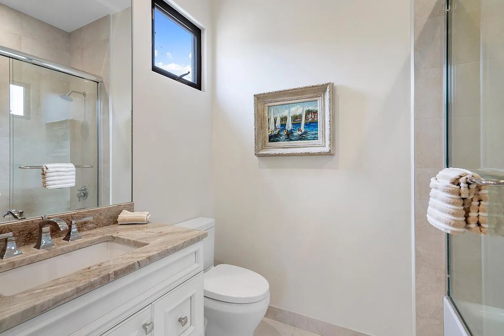 Experience the epitome of luxury living at 420 E Coconut Palm Road, Boca Raton, Florida. This meticulously renovated waterfront estate showcases 7 beds, 9 baths, and 7,216 sq ft of opulent living space.