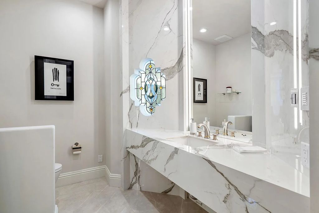 Experience the epitome of luxury living at 420 E Coconut Palm Road, Boca Raton, Florida. This meticulously renovated waterfront estate showcases 7 beds, 9 baths, and 7,216 sq ft of opulent living space.