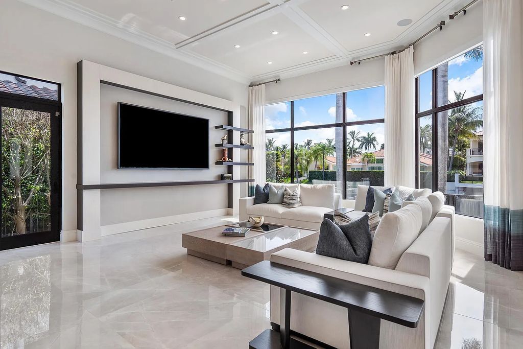 Experience the epitome of luxury living at 420 E Coconut Palm Road, Boca Raton, Florida. This meticulously renovated waterfront estate showcases 7 beds, 9 baths, and 7,216 sq ft of opulent living space.