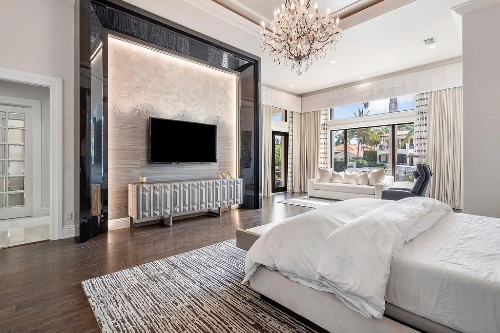 Experience the epitome of luxury living at 420 E Coconut Palm Road, Boca Raton, Florida. This meticulously renovated waterfront estate showcases 7 beds, 9 baths, and 7,216 sq ft of opulent living space.