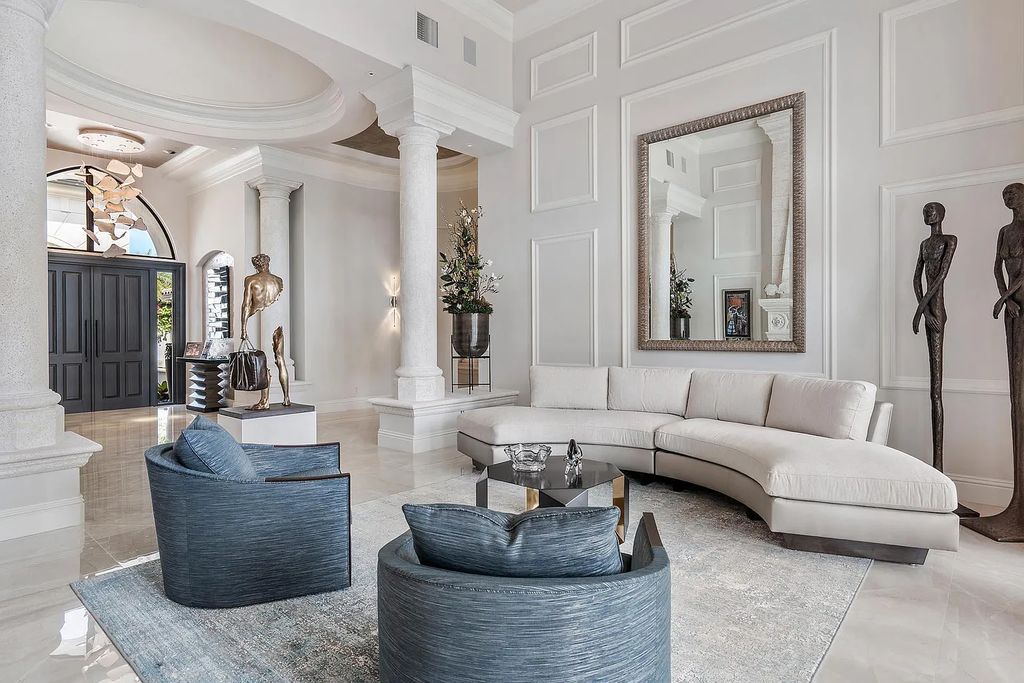 Experience the epitome of luxury living at 420 E Coconut Palm Road, Boca Raton, Florida. This meticulously renovated waterfront estate showcases 7 beds, 9 baths, and 7,216 sq ft of opulent living space.
