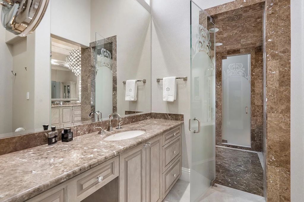 Experience the epitome of luxury living at 420 E Coconut Palm Road, Boca Raton, Florida. This meticulously renovated waterfront estate showcases 7 beds, 9 baths, and 7,216 sq ft of opulent living space.