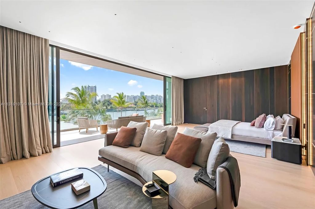 Presenting 98 La Gorce Circle, Miami Beach, Florida an extraordinary Villa Arte by Aquablue Group on Miami Beach's exclusive La Gorce Island. This stunning 7-bedrooms, 13-bathrooms residence spans 14,060 square feet, situated on a 0.76-acre lot.
