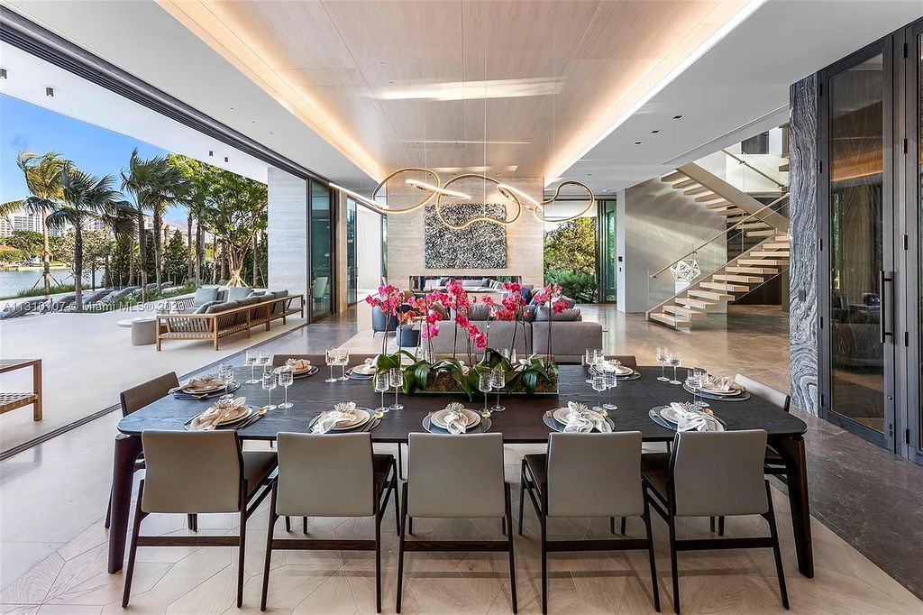 Presenting 98 La Gorce Circle, Miami Beach, Florida an extraordinary Villa Arte by Aquablue Group on Miami Beach's exclusive La Gorce Island. This stunning 7-bedrooms, 13-bathrooms residence spans 14,060 square feet, situated on a 0.76-acre lot.
