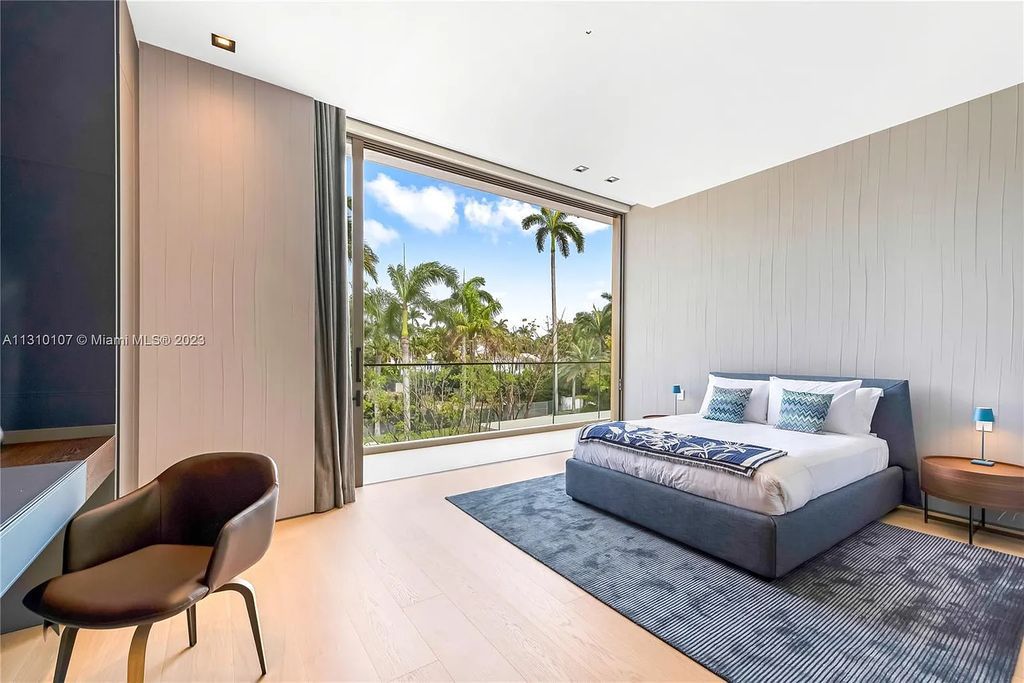 Presenting 98 La Gorce Circle, Miami Beach, Florida an extraordinary Villa Arte by Aquablue Group on Miami Beach's exclusive La Gorce Island. This stunning 7-bedrooms, 13-bathrooms residence spans 14,060 square feet, situated on a 0.76-acre lot.