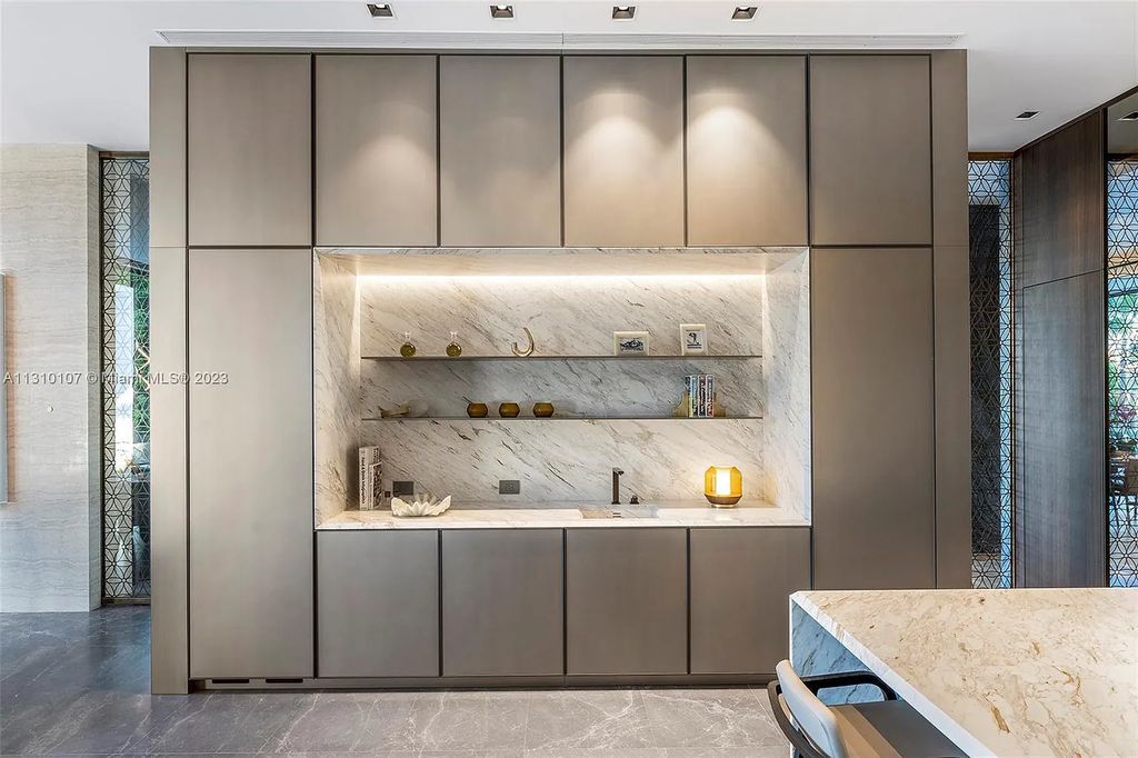 Presenting 98 La Gorce Circle, Miami Beach, Florida an extraordinary Villa Arte by Aquablue Group on Miami Beach's exclusive La Gorce Island. This stunning 7-bedrooms, 13-bathrooms residence spans 14,060 square feet, situated on a 0.76-acre lot.