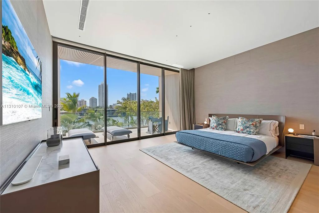 Presenting 98 La Gorce Circle, Miami Beach, Florida an extraordinary Villa Arte by Aquablue Group on Miami Beach's exclusive La Gorce Island. This stunning 7-bedrooms, 13-bathrooms residence spans 14,060 square feet, situated on a 0.76-acre lot.