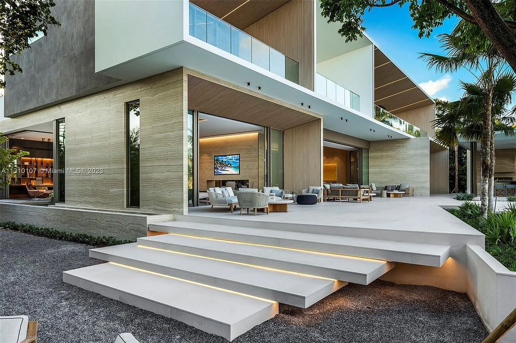 Presenting 98 La Gorce Circle, Miami Beach, Florida an extraordinary Villa Arte by Aquablue Group on Miami Beach's exclusive La Gorce Island. This stunning 7-bedrooms, 13-bathrooms residence spans 14,060 square feet, situated on a 0.76-acre lot.