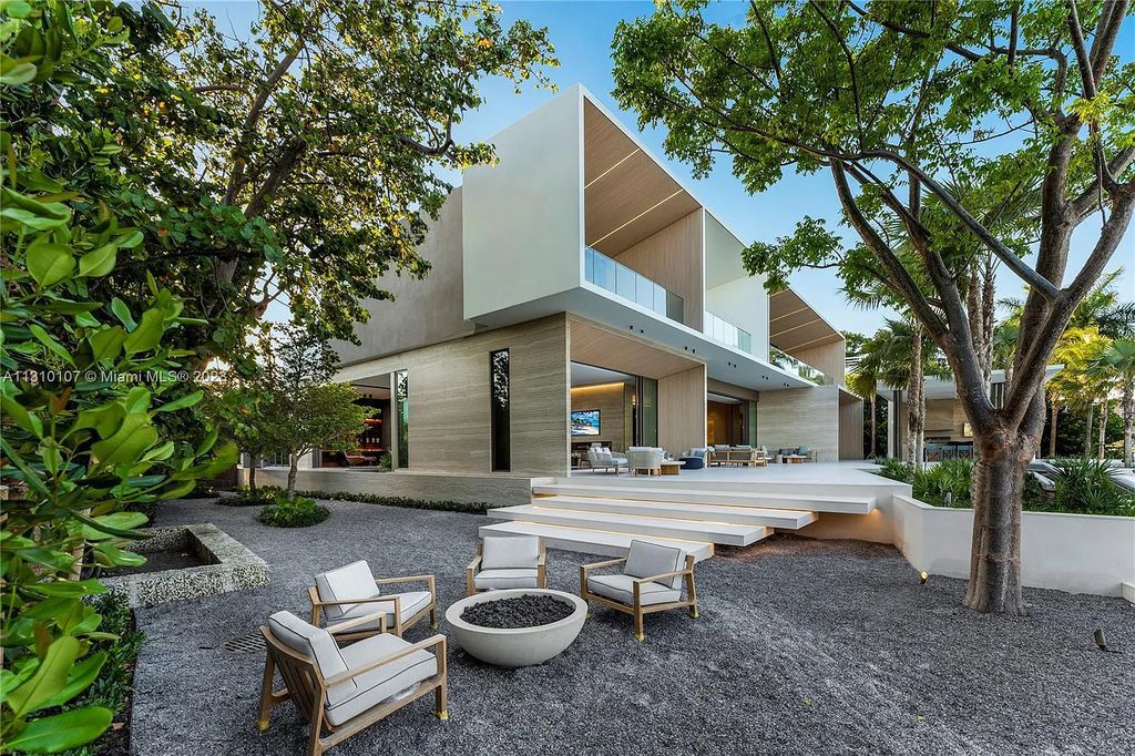 Presenting 98 La Gorce Circle, Miami Beach, Florida an extraordinary Villa Arte by Aquablue Group on Miami Beach's exclusive La Gorce Island. This stunning 7-bedrooms, 13-bathrooms residence spans 14,060 square feet, situated on a 0.76-acre lot.