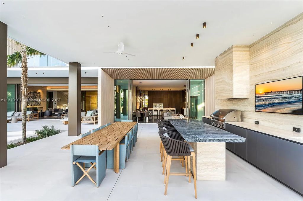 Presenting 98 La Gorce Circle, Miami Beach, Florida an extraordinary Villa Arte by Aquablue Group on Miami Beach's exclusive La Gorce Island. This stunning 7-bedrooms, 13-bathrooms residence spans 14,060 square feet, situated on a 0.76-acre lot.