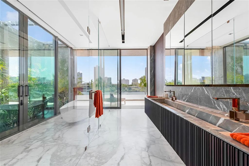 Presenting 98 La Gorce Circle, Miami Beach, Florida an extraordinary Villa Arte by Aquablue Group on Miami Beach's exclusive La Gorce Island. This stunning 7-bedrooms, 13-bathrooms residence spans 14,060 square feet, situated on a 0.76-acre lot.