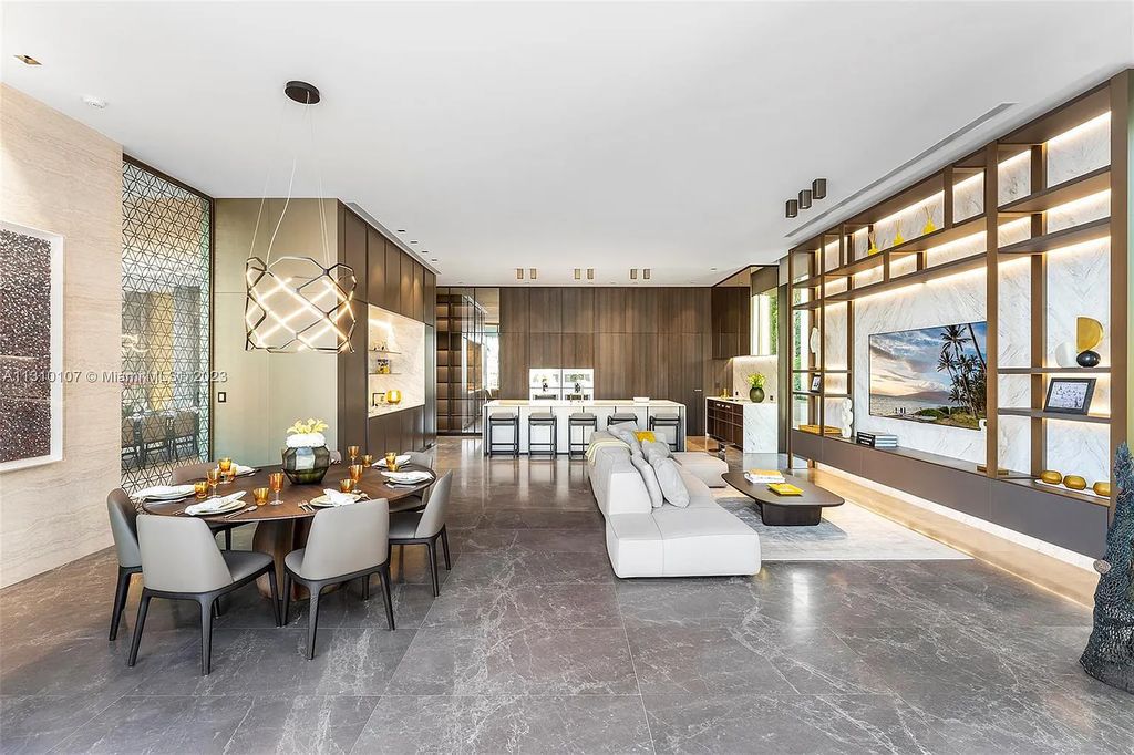 Presenting 98 La Gorce Circle, Miami Beach, Florida an extraordinary Villa Arte by Aquablue Group on Miami Beach's exclusive La Gorce Island. This stunning 7-bedrooms, 13-bathrooms residence spans 14,060 square feet, situated on a 0.76-acre lot.