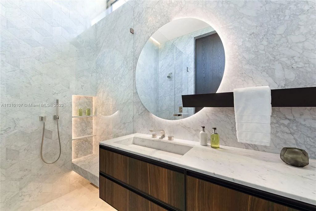 Presenting 98 La Gorce Circle, Miami Beach, Florida an extraordinary Villa Arte by Aquablue Group on Miami Beach's exclusive La Gorce Island. This stunning 7-bedrooms, 13-bathrooms residence spans 14,060 square feet, situated on a 0.76-acre lot.