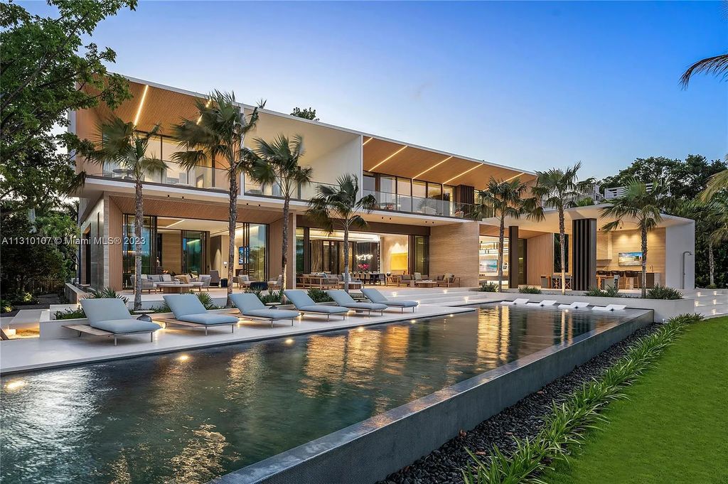 Presenting 98 La Gorce Circle, Miami Beach, Florida an extraordinary Villa Arte by Aquablue Group on Miami Beach's exclusive La Gorce Island. This stunning 7-bedrooms, 13-bathrooms residence spans 14,060 square feet, situated on a 0.76-acre lot.
