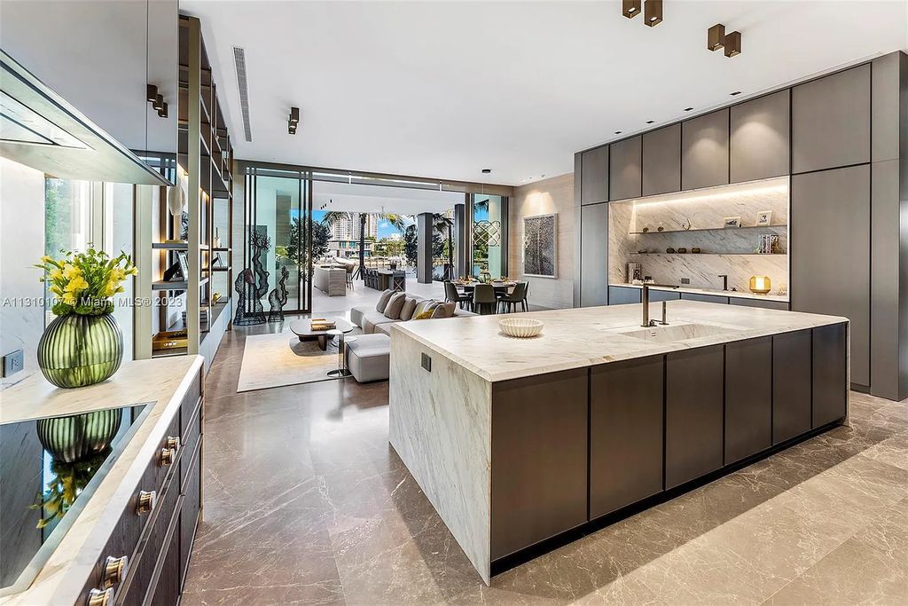 Presenting 98 La Gorce Circle, Miami Beach, Florida an extraordinary Villa Arte by Aquablue Group on Miami Beach's exclusive La Gorce Island. This stunning 7-bedrooms, 13-bathrooms residence spans 14,060 square feet, situated on a 0.76-acre lot.
