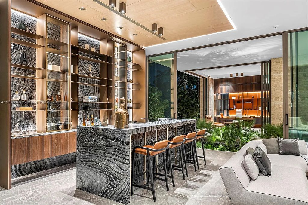 Presenting 98 La Gorce Circle, Miami Beach, Florida an extraordinary Villa Arte by Aquablue Group on Miami Beach's exclusive La Gorce Island. This stunning 7-bedrooms, 13-bathrooms residence spans 14,060 square feet, situated on a 0.76-acre lot.